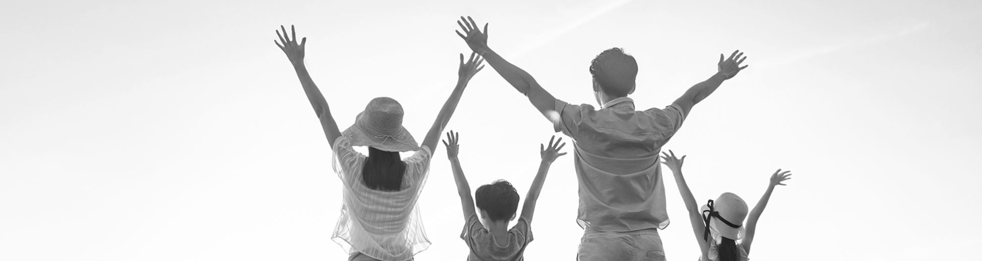 Happy young family on meadow